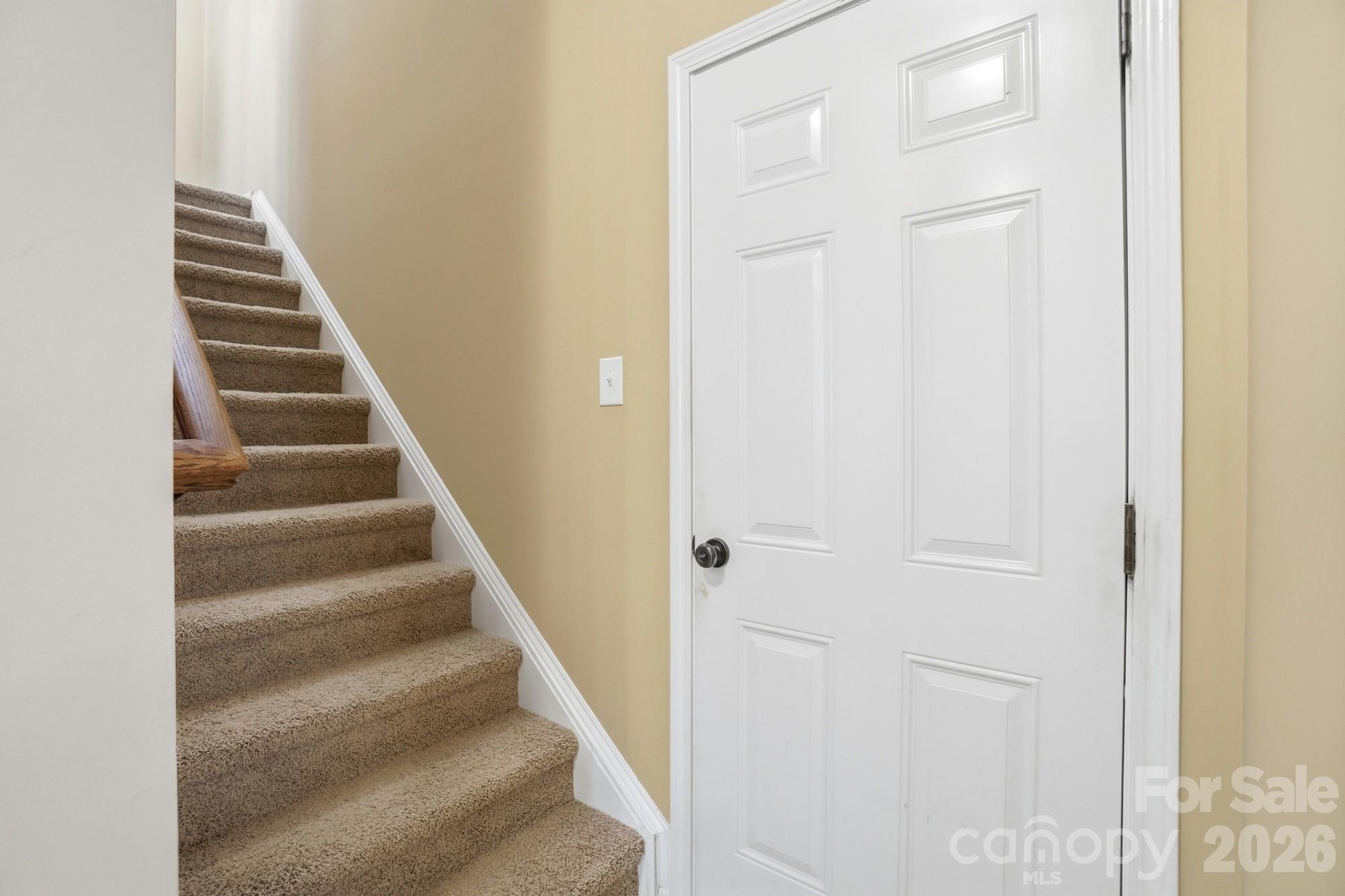 425 Silver Cypress Lane Fort Mill, SC 29708 - Photo 28 of 40 a view of staircase with white walls and white door