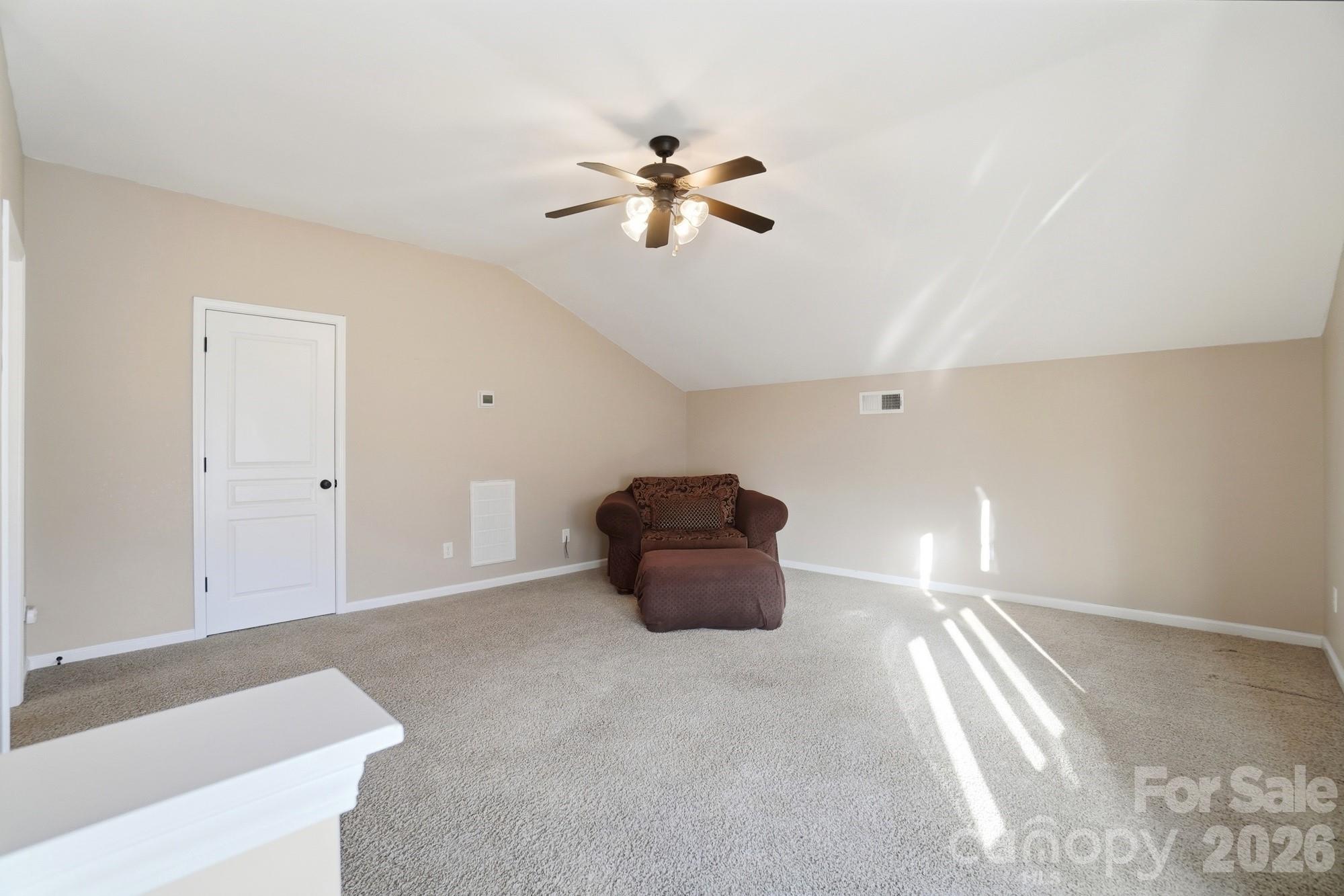 425 Silver Cypress Lane Fort Mill, SC 29708 - Photo 30 of 40 a view of a livingroom with a ceiling fan and window