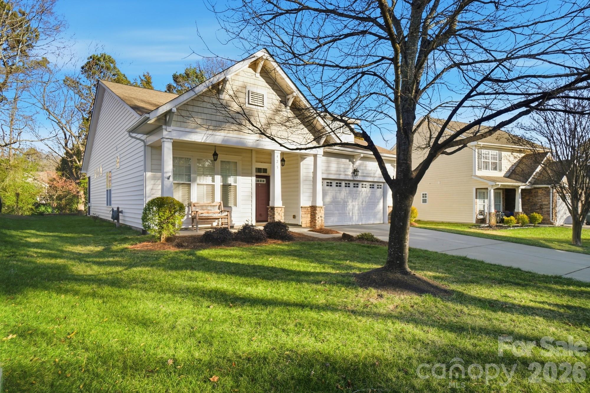 425 Silver Cypress Lane Fort Mill, SC 29708 - Photo 3 of 40 a front view of a house with garden