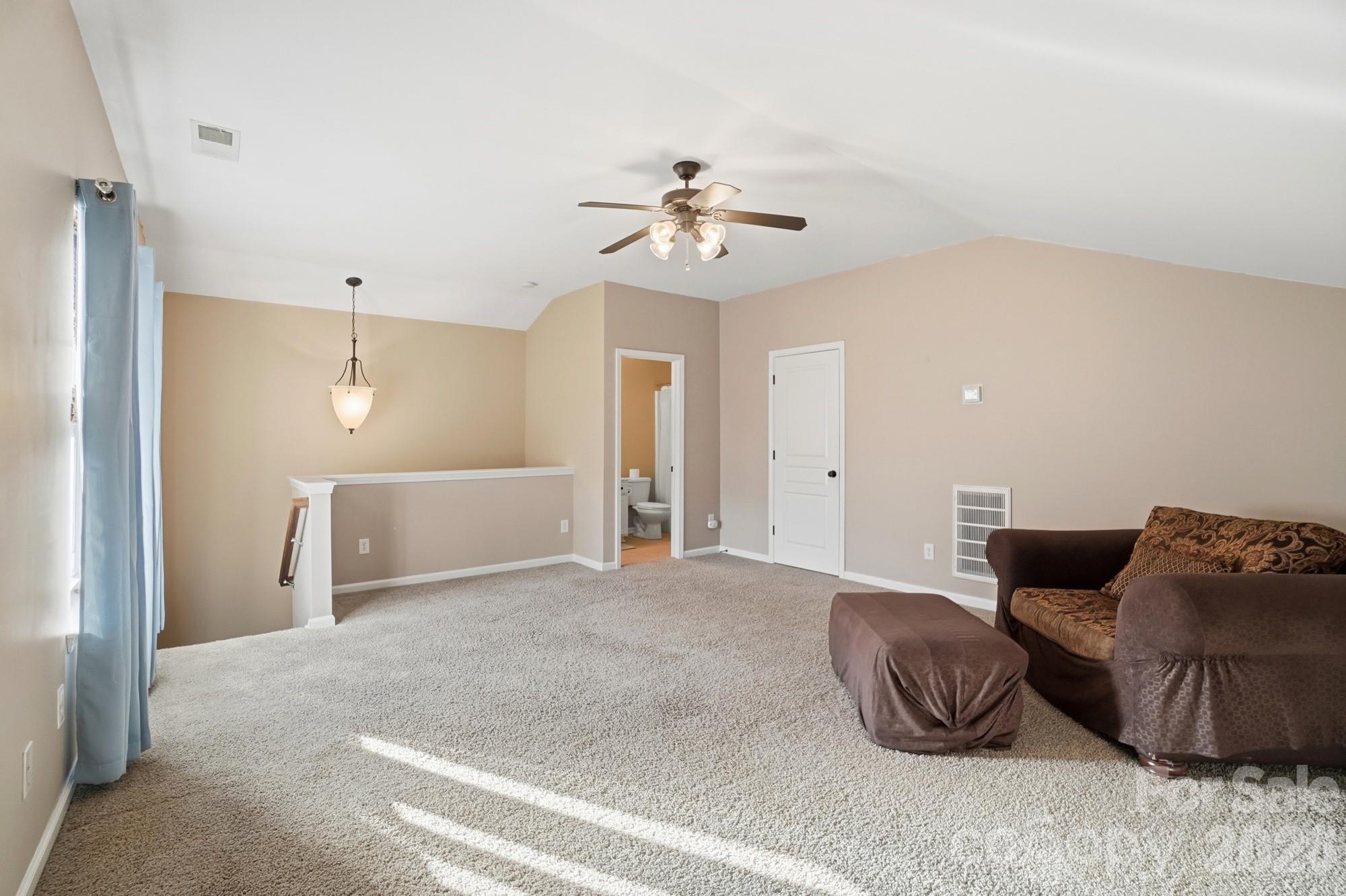 425 Silver Cypress Lane Fort Mill, SC 29708 - Photo 32 of 40 a living room with furniture and a ceiling fan