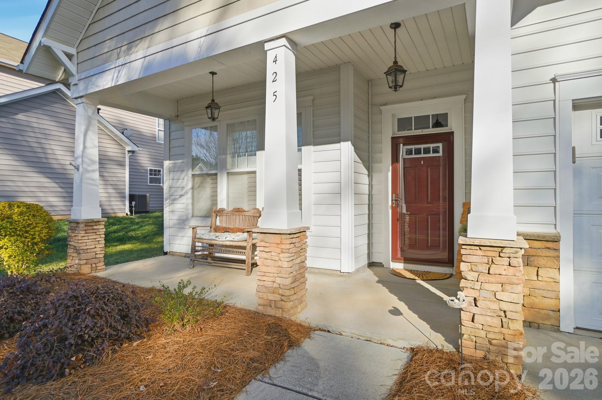 425 Silver Cypress Lane Fort Mill, SC 29708 - Photo 4 of 40 a backyard of a house with barbeque oven table and chairs
