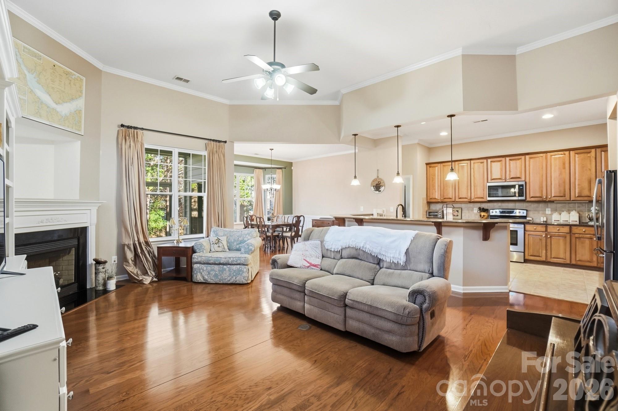 425 Silver Cypress Lane Fort Mill, SC 29708 - Photo 9 of 40 a living room with furniture and a fireplace