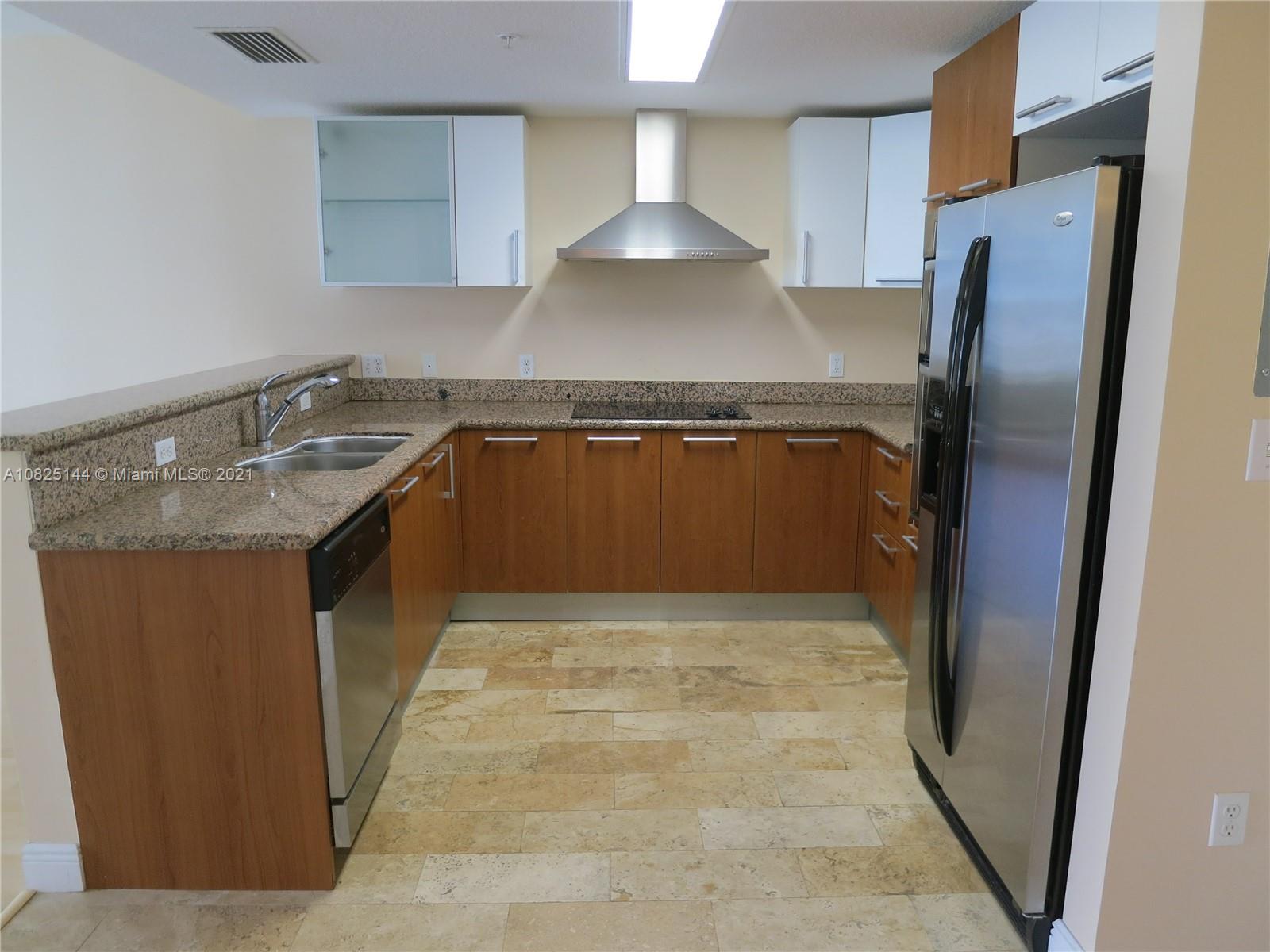 170 Southeast 14th Street, Unit 1507 Miami, FL 33131 - Photo 12 of 25 a view of kitchen with stainless steel appliances granite countertop a refrigerator and a sink