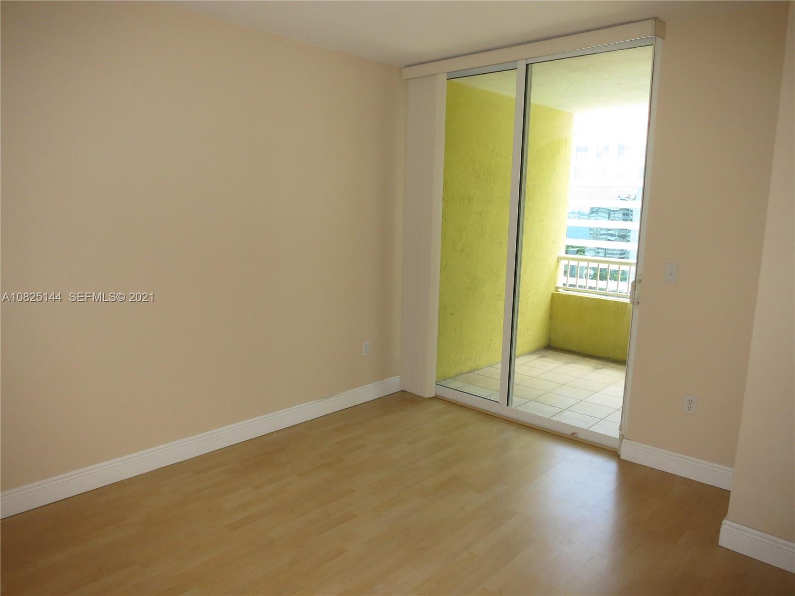 170 Southeast 14th Street, Unit 1507 Miami, FL 33131 - Photo 22 of 25 an empty room with a window
