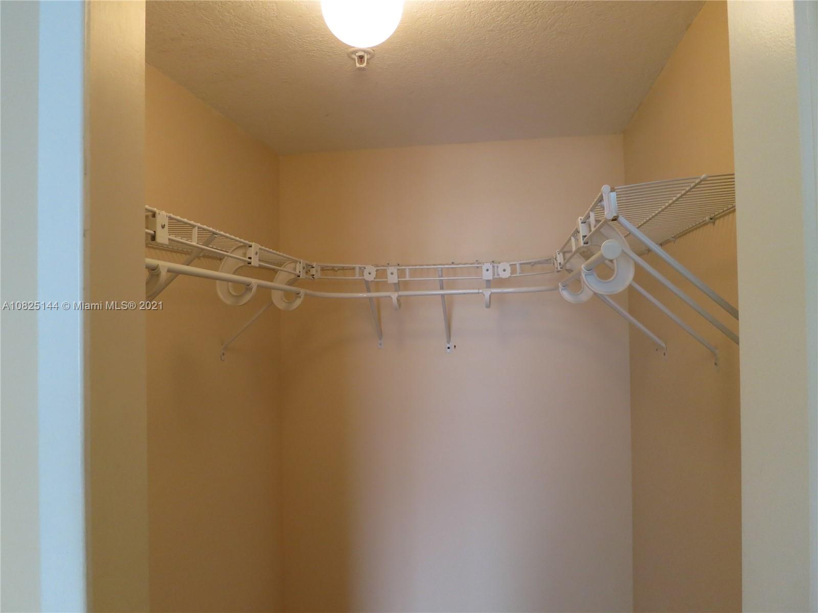 170 Southeast 14th Street, Unit 1507 Miami, FL 33131 - Photo 23 of 25 a view of a room with racks on the wall