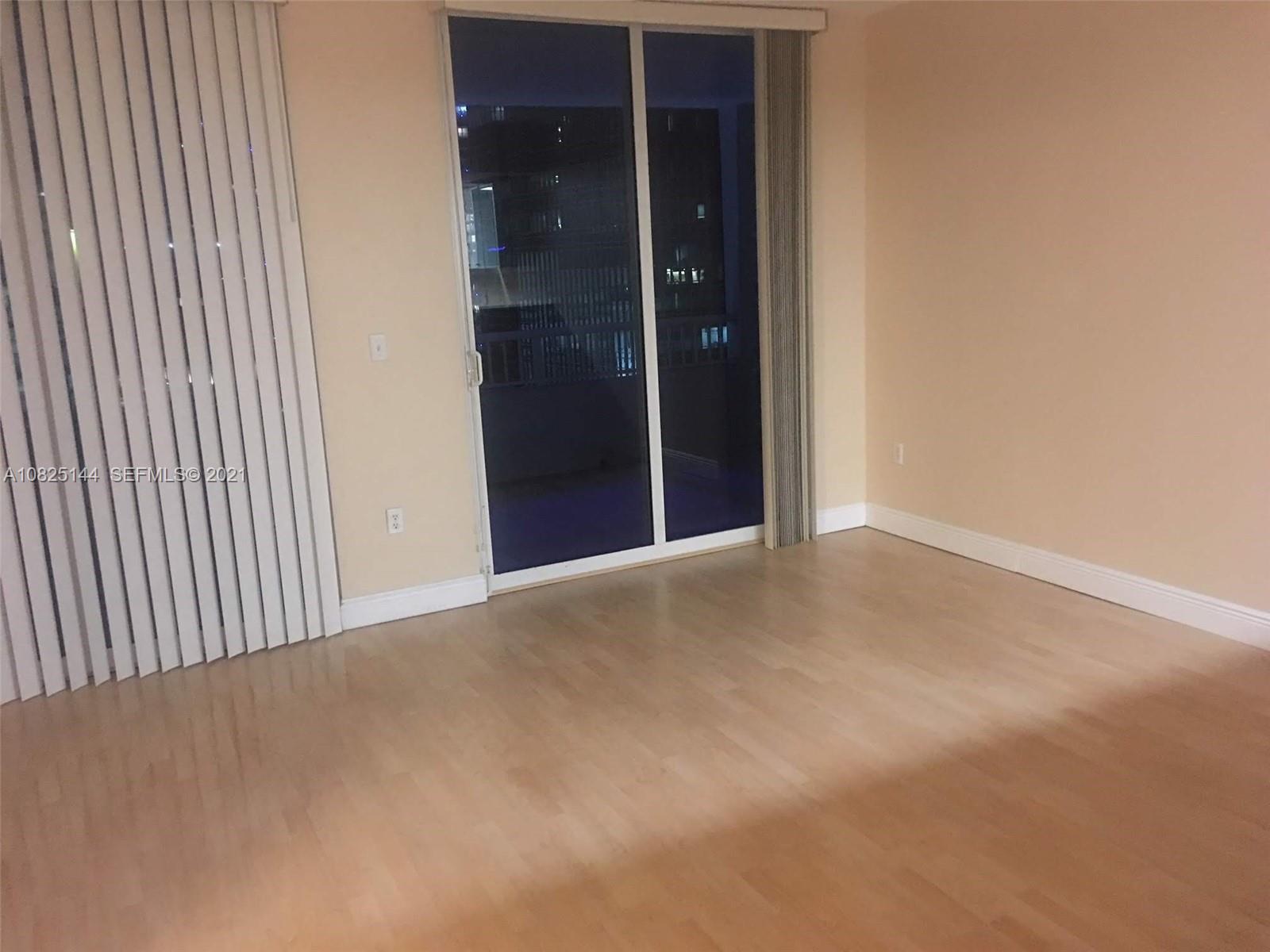 170 Southeast 14th Street, Unit 1507 Miami, FL 33131 - Photo 4 of 25 an empty room with windows