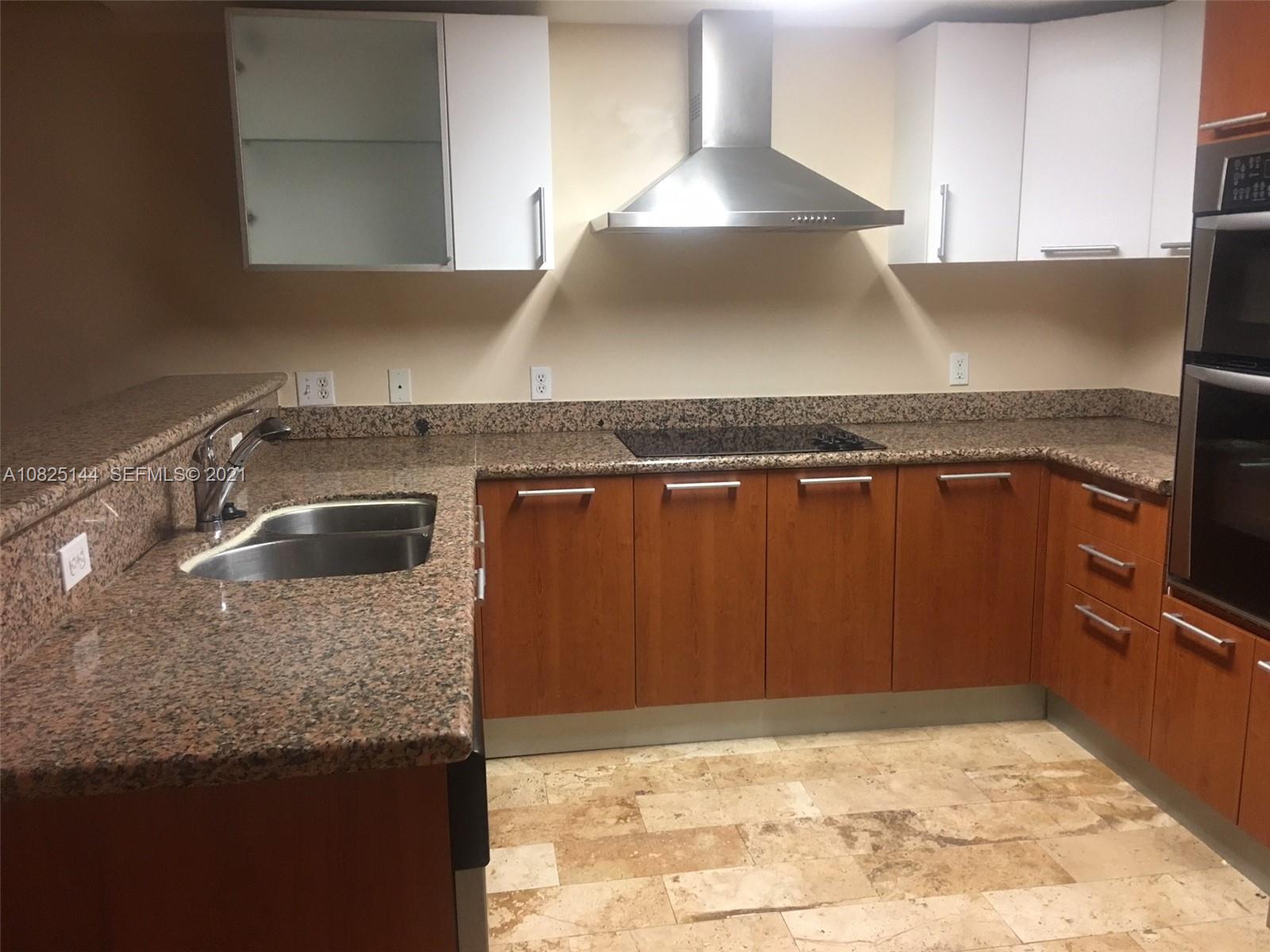 170 Southeast 14th Street, Unit 1507 Miami, FL 33131 - Photo 6 of 25 a close view of sink and stove