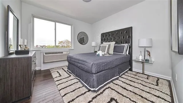 a living room with a couch and a large window