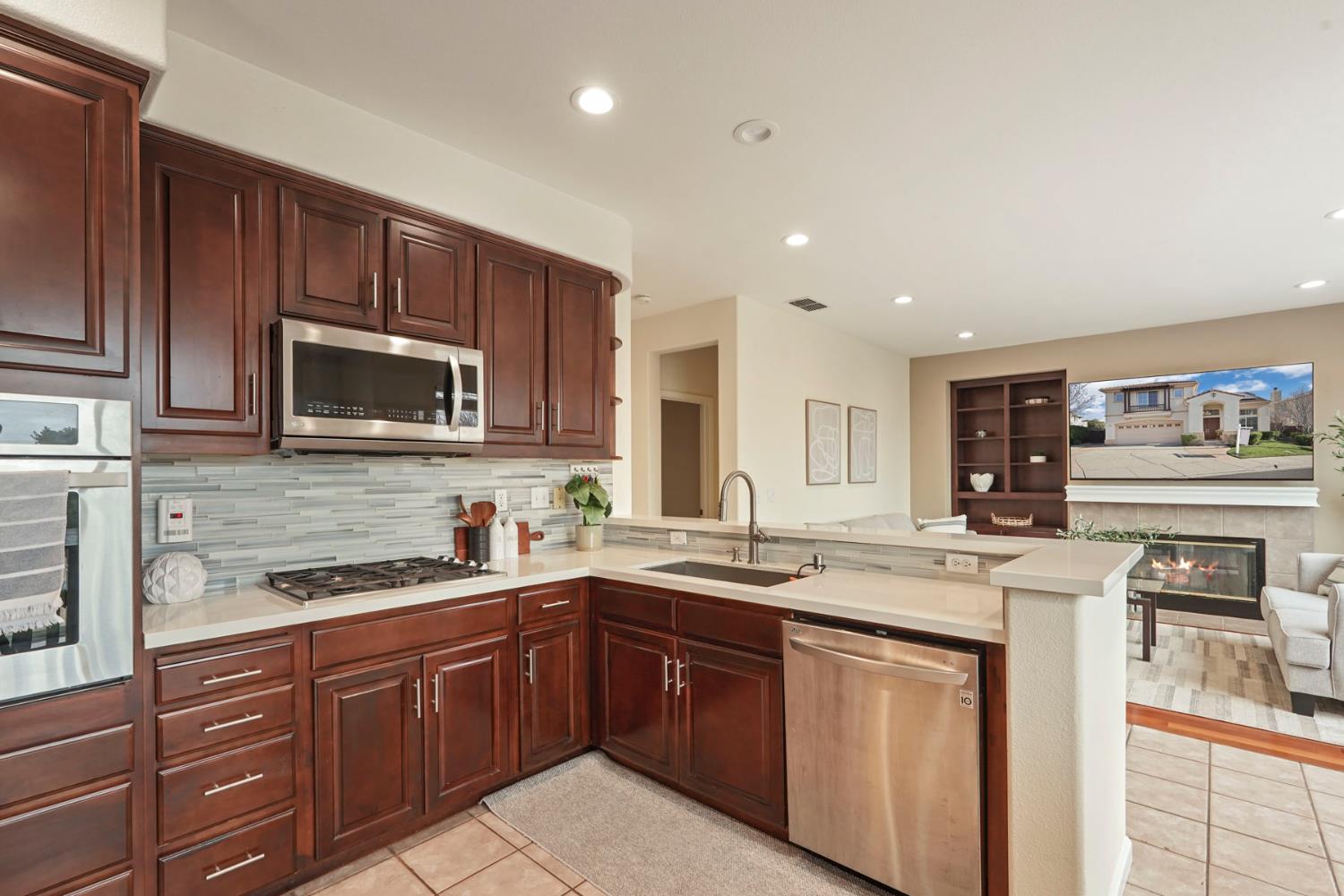 732 Pradera Way San Ramon, CA 94583 - Photo 12 of 45 a kitchen with stainless steel appliances granite countertop a sink stove and microwave