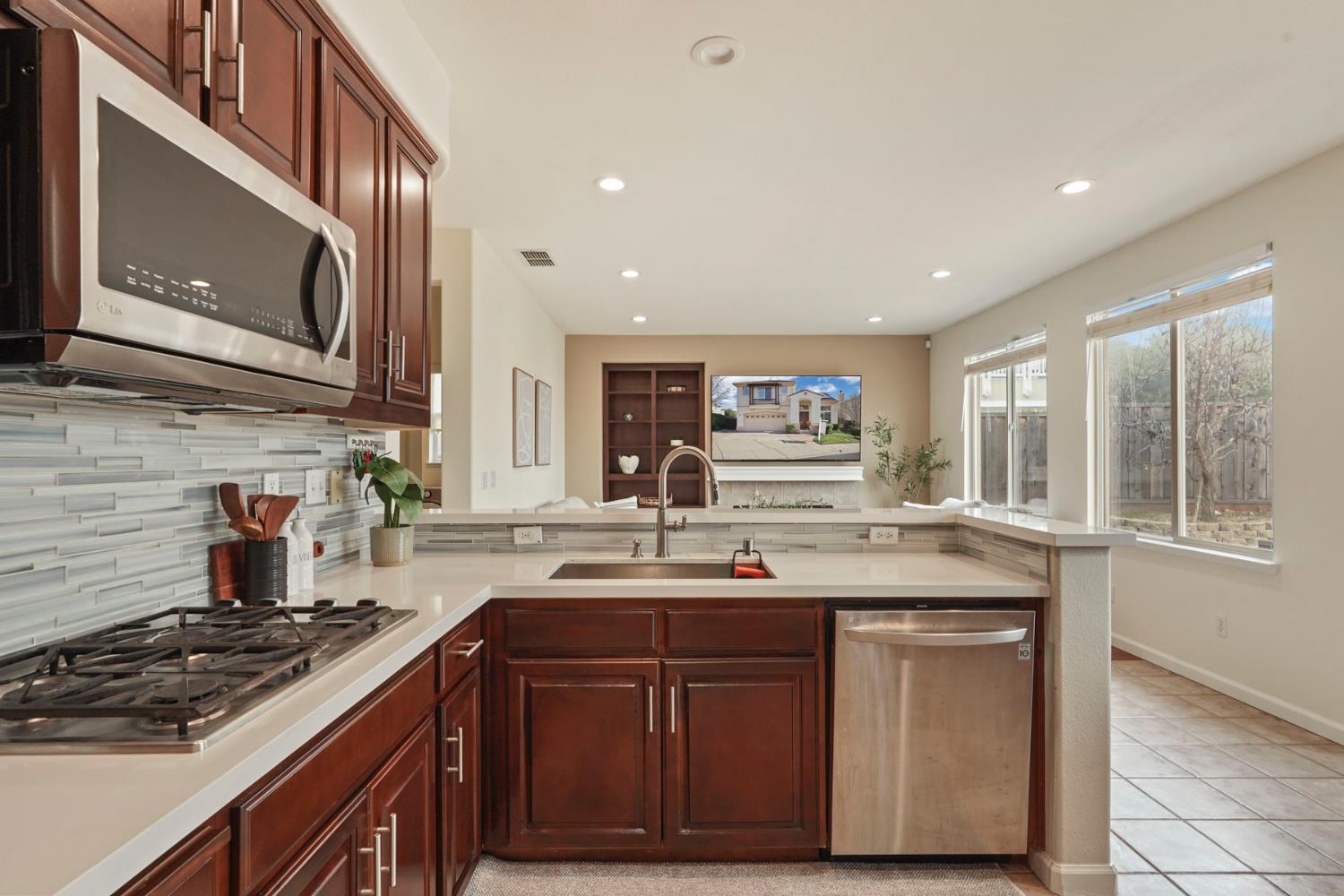 732 Pradera Way San Ramon, CA 94583 - Photo 15 of 45 a kitchen with stainless steel appliances granite countertop a sink and a stove