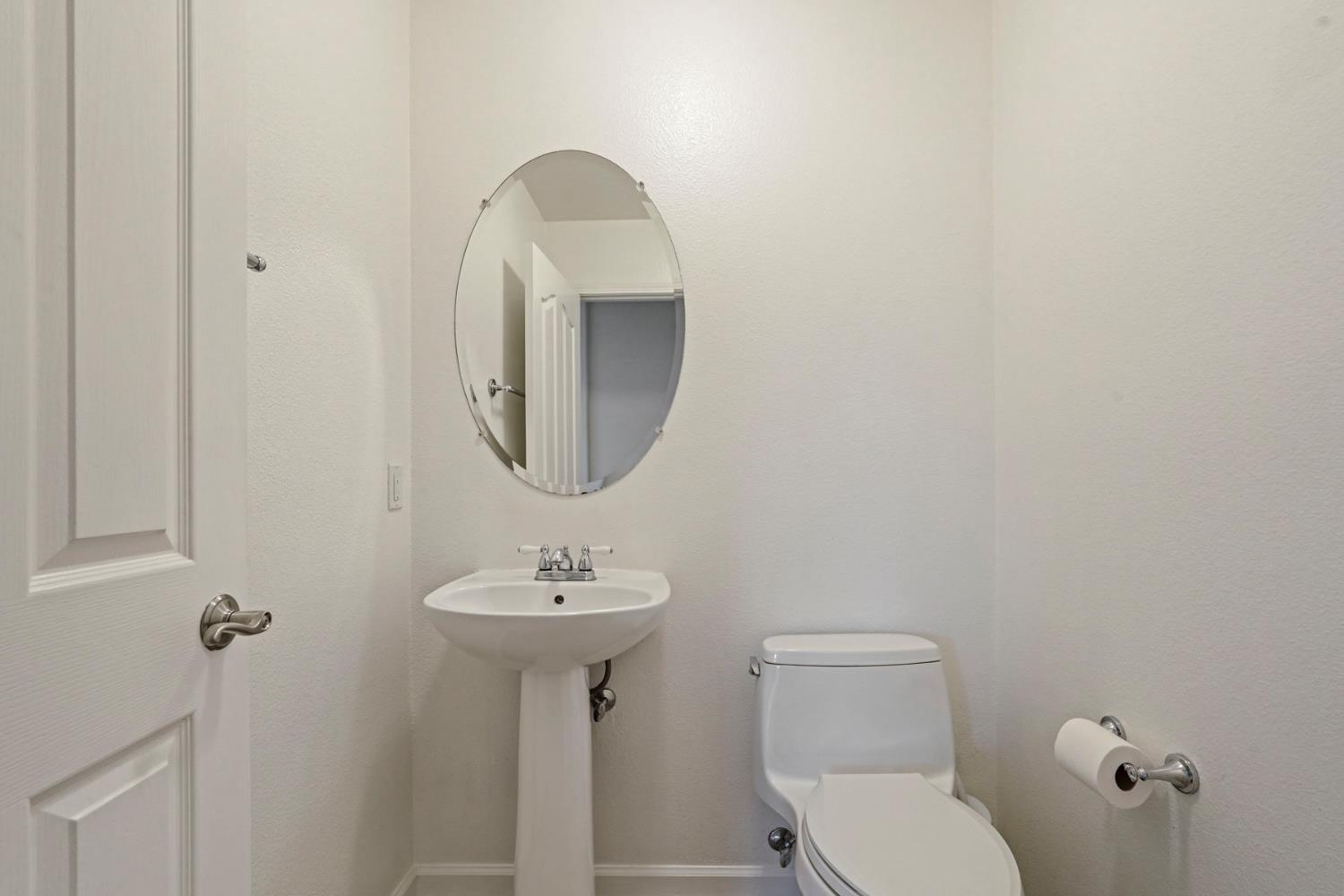 732 Pradera Way San Ramon, CA 94583 - Photo 17 of 45 a bathroom with a toilet sink and mirror