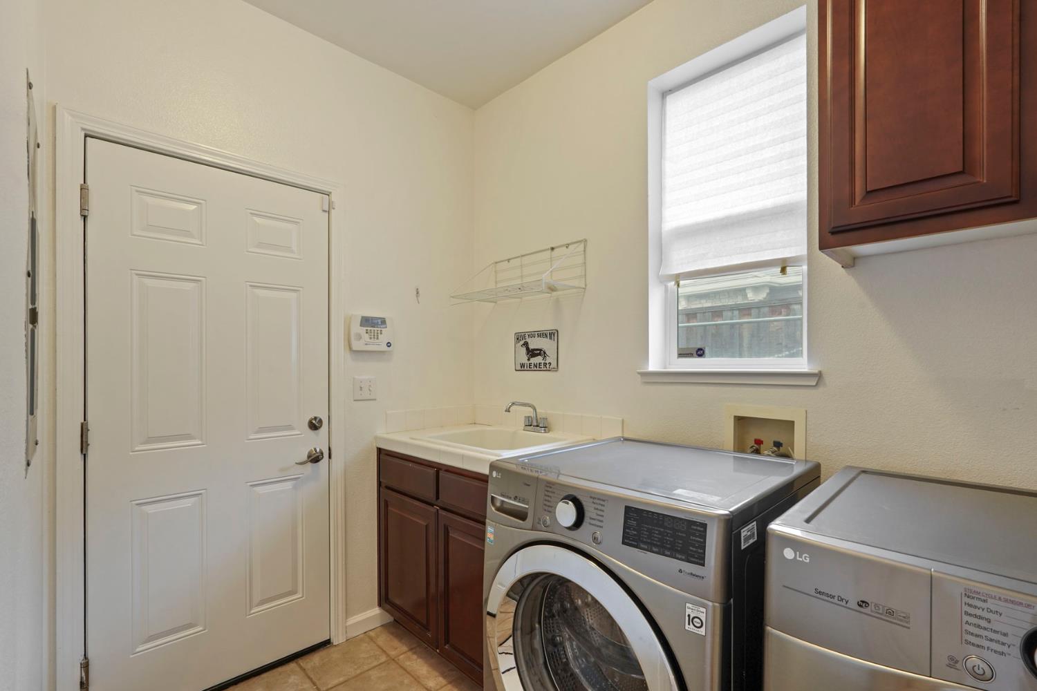 732 Pradera Way San Ramon, CA 94583 - Photo 18 of 45 a utility room with dryer and washer