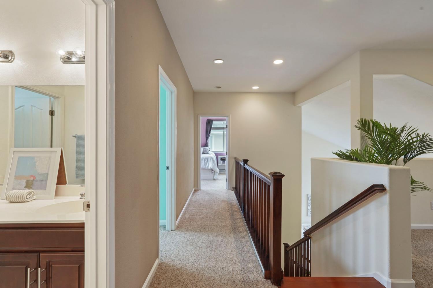 732 Pradera Way San Ramon, CA 94583 - Photo 19 of 45 a view of hallway with a sink and a mirror