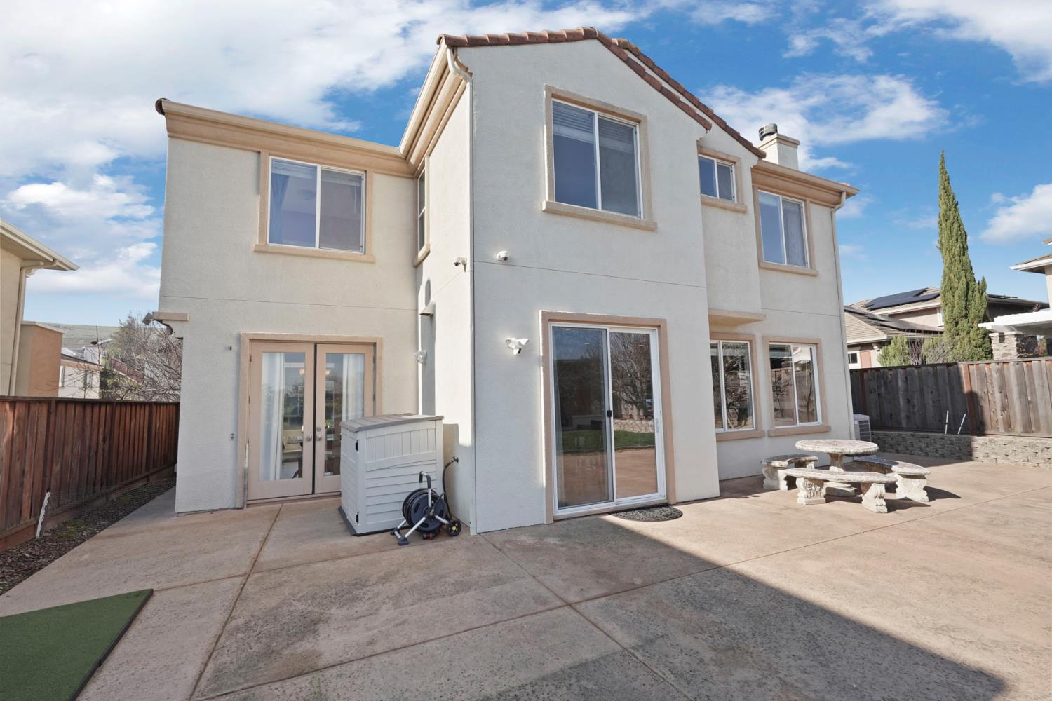 732 Pradera Way San Ramon, CA 94583 - Photo 39 of 45 a view of a patio with a table and chairs and potted plants