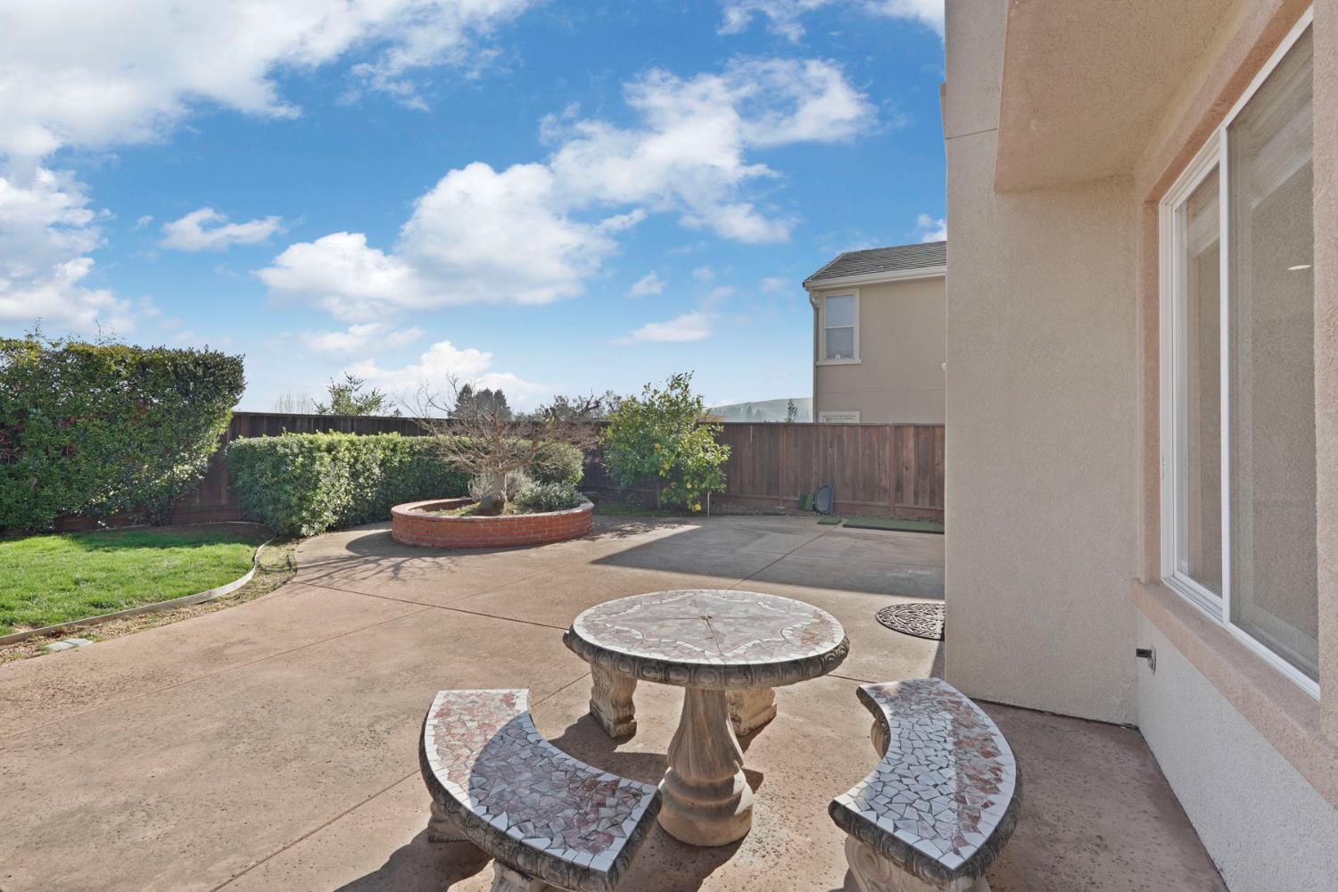 732 Pradera Way San Ramon, CA 94583 - Photo 41 of 45 a view of a chair and table in the backyard