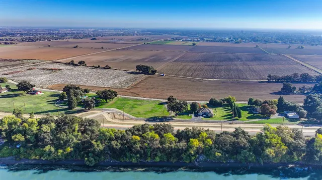 an aerial view of beach and yard