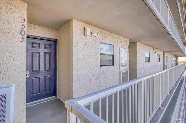 a view of a palm trees in front of a building