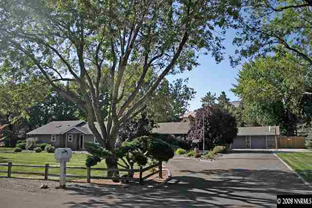5100 Eldorado Drive Reno, NV 89519 - Photo 1 of 9 a front view of a house with a yard and large trees