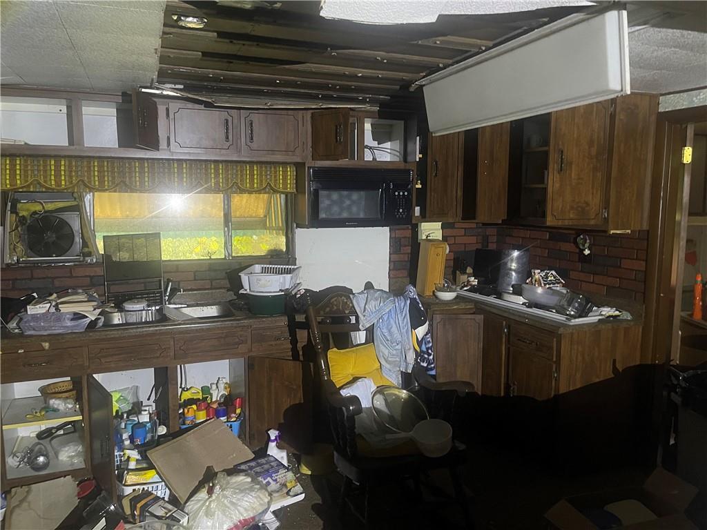 311 Mt Tabor Road Coal Center, PA 15423 - Photo 6 of 10 a kitchen with a refrigerator and a stove top oven