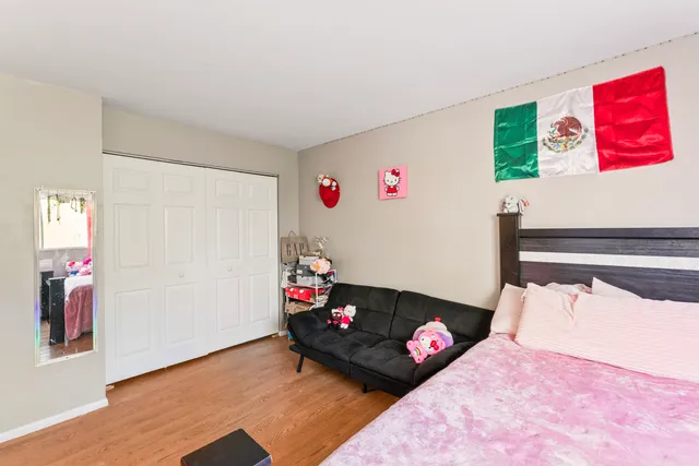 a bedroom with a bed and a couch