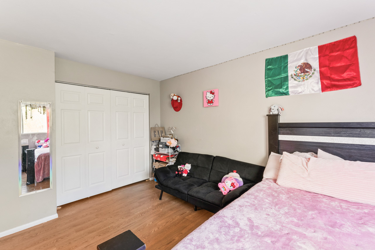 2504 West Algonquin Road, Unit 17 Rolling Meadows, IL 60008 - Photo 13 of 21 a bedroom with a bed and a couch