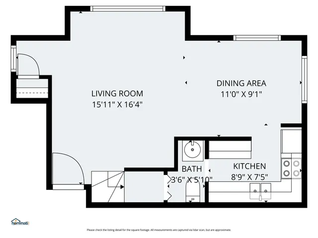 a black and white photo of a living room