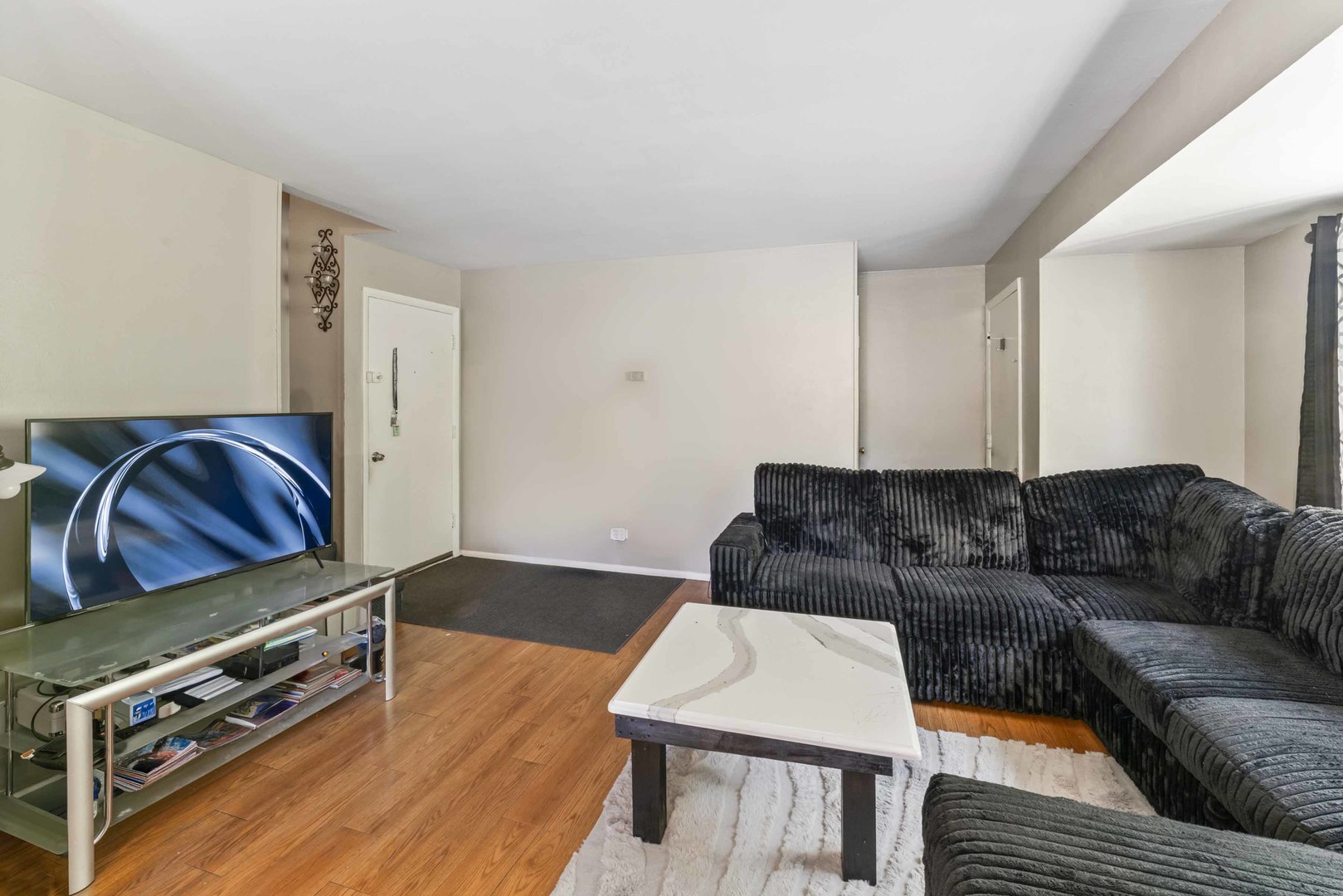 2504 West Algonquin Road, Unit 17 Rolling Meadows, IL 60008 - Photo 5 of 21 a living room with furniture and a couch