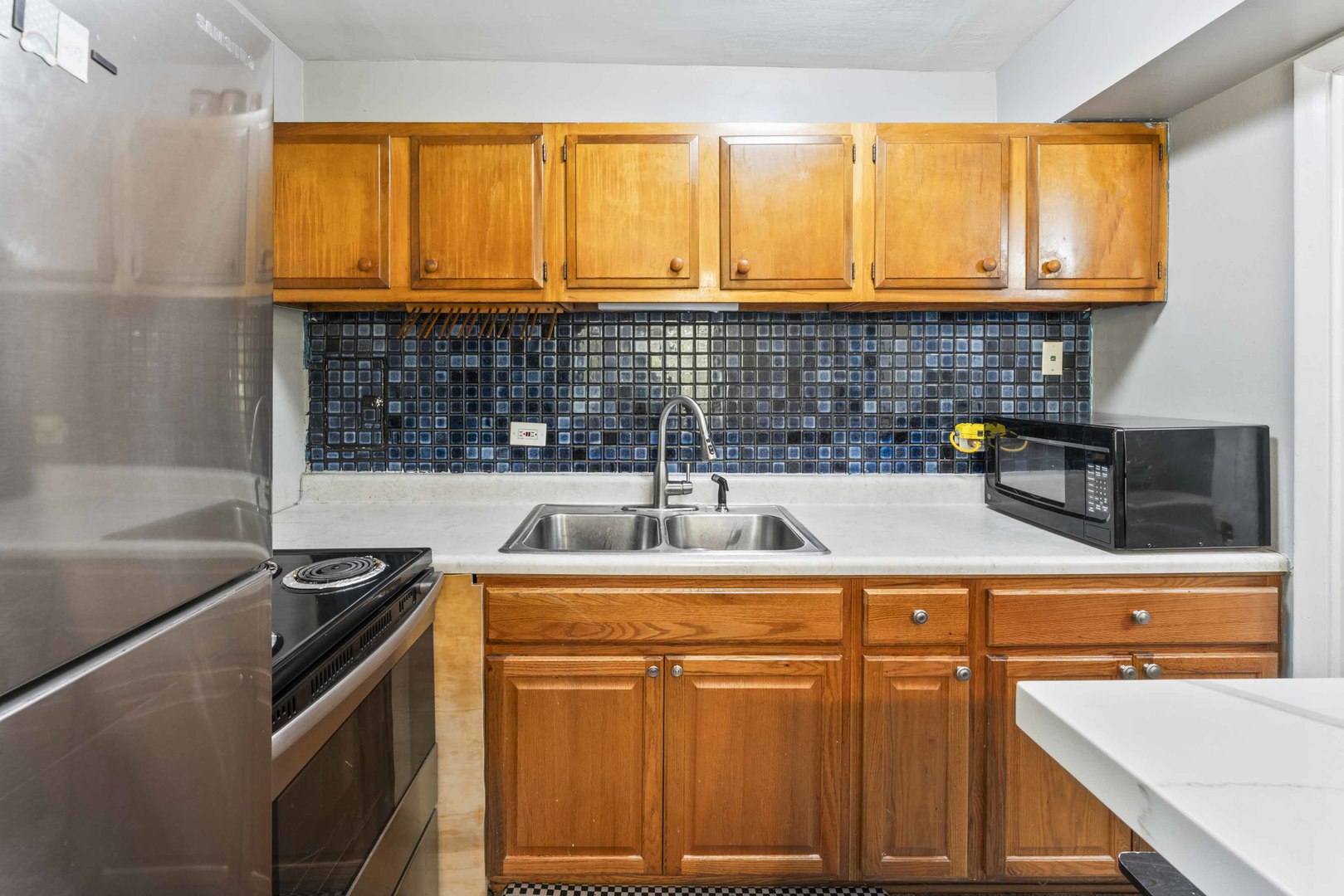 2504 West Algonquin Road, Unit 17 Rolling Meadows, IL 60008 - Photo 9 of 21 a kitchen with a sink and a stove