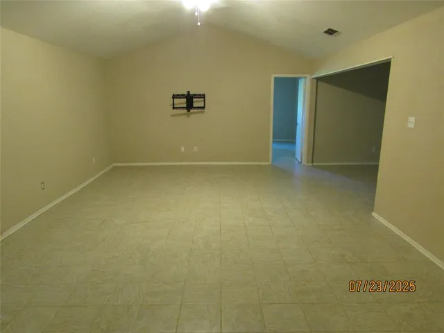 a view of a house with a tree