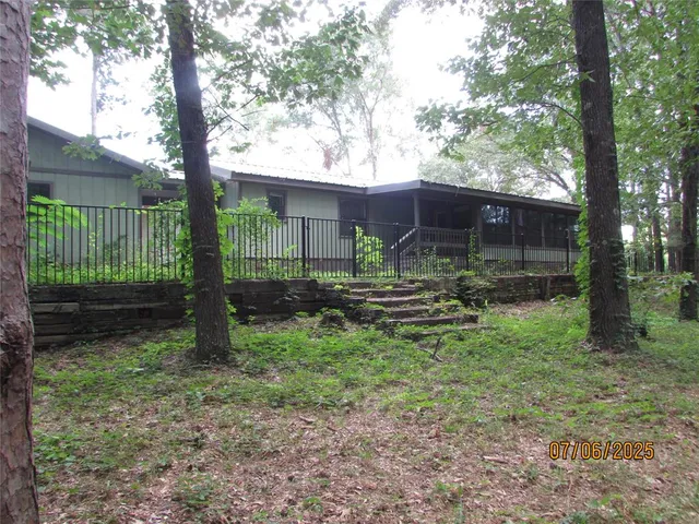 a backyard of a house with lots of green space