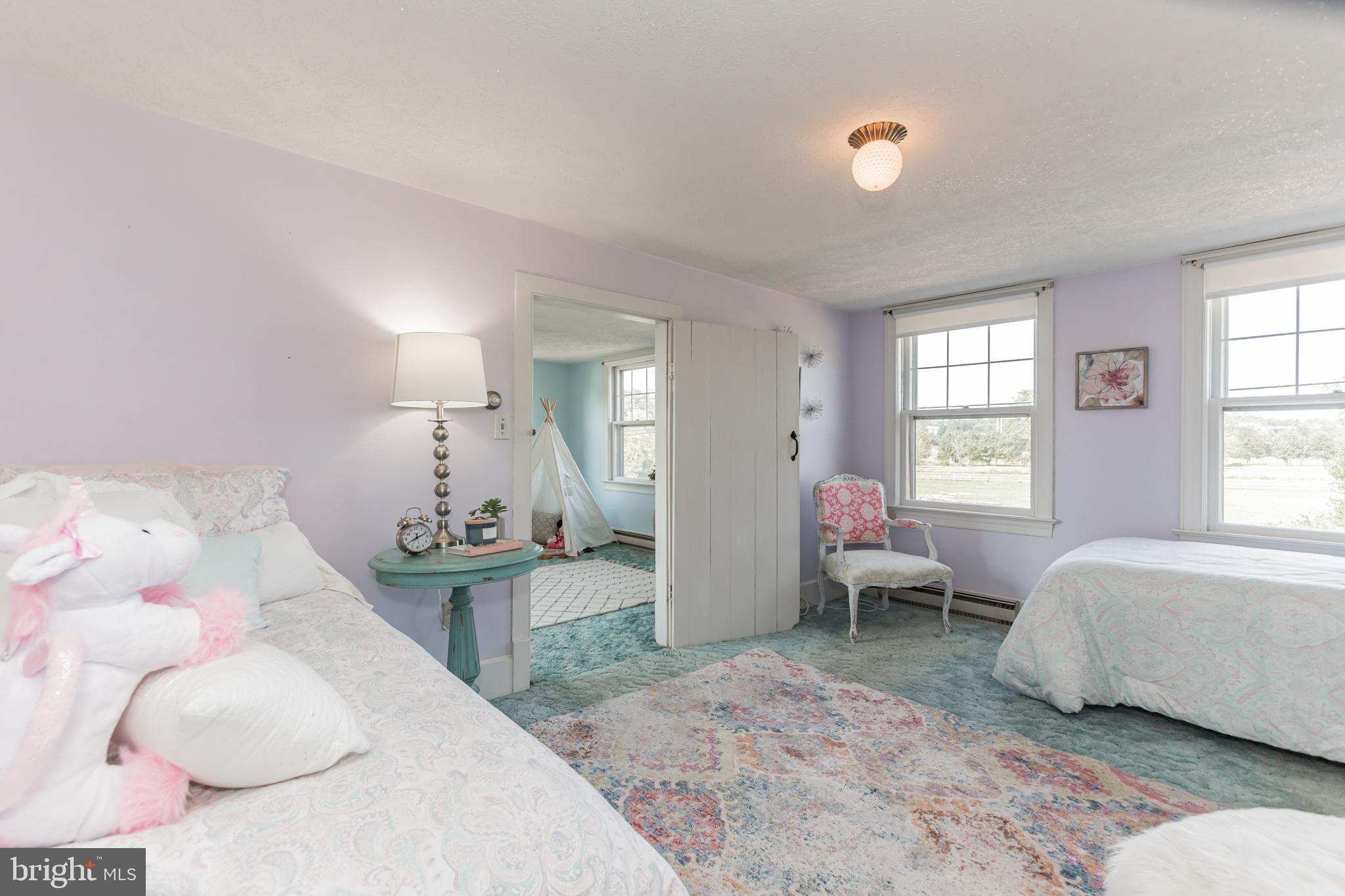 28814 Kemptown Road Damascus, MD 20872 - Photo 21 of 49 a bedroom with a bed and large window