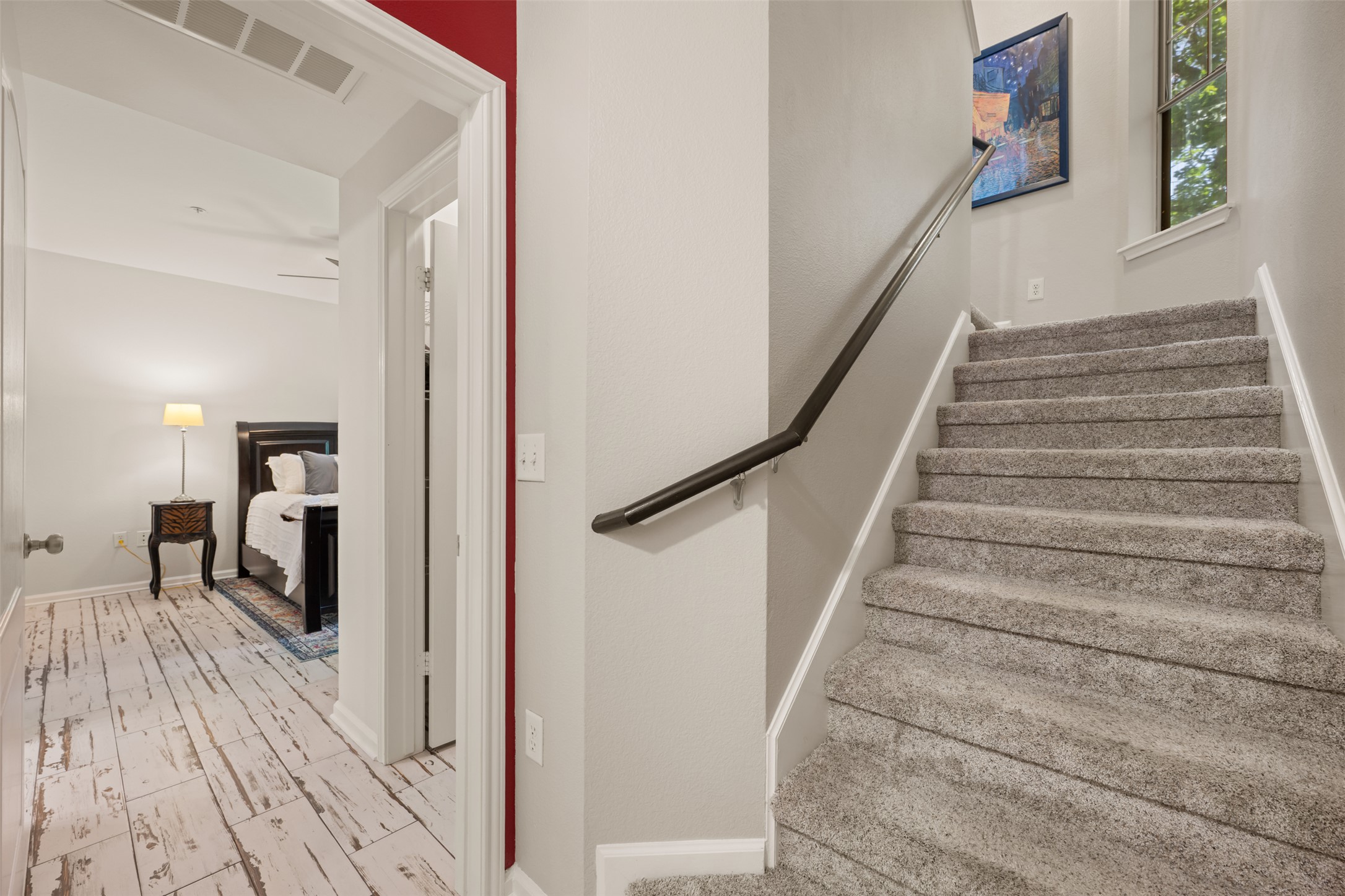 11203 Ranch Road 2222, Unit 1407 Austin, TX 78732 - Photo 9 of 40 The primary suite is secluded away on the entry level to the left of the stairway, perfect for peace and privacy.