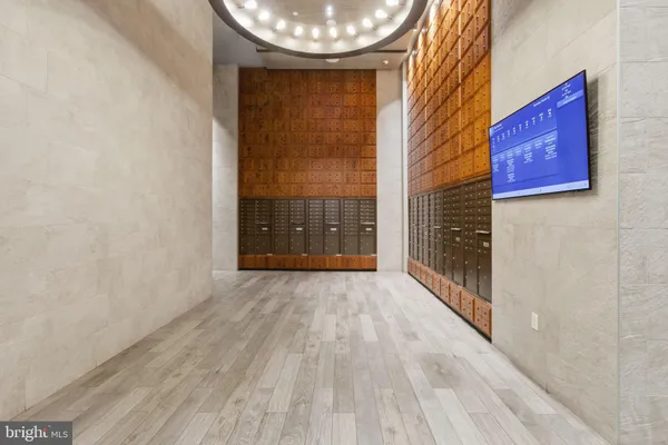 a view of a room with wooden floor and a window