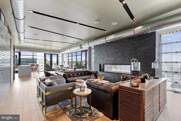 a living room with furniture fireplace and a flat screen tv