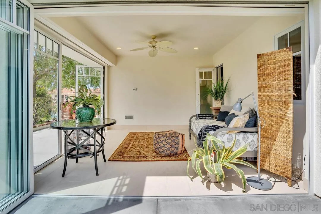 5735 Dolphin Place La Jolla, CA 92037 - Photo 20 of 75 a living room with furniture and a large window