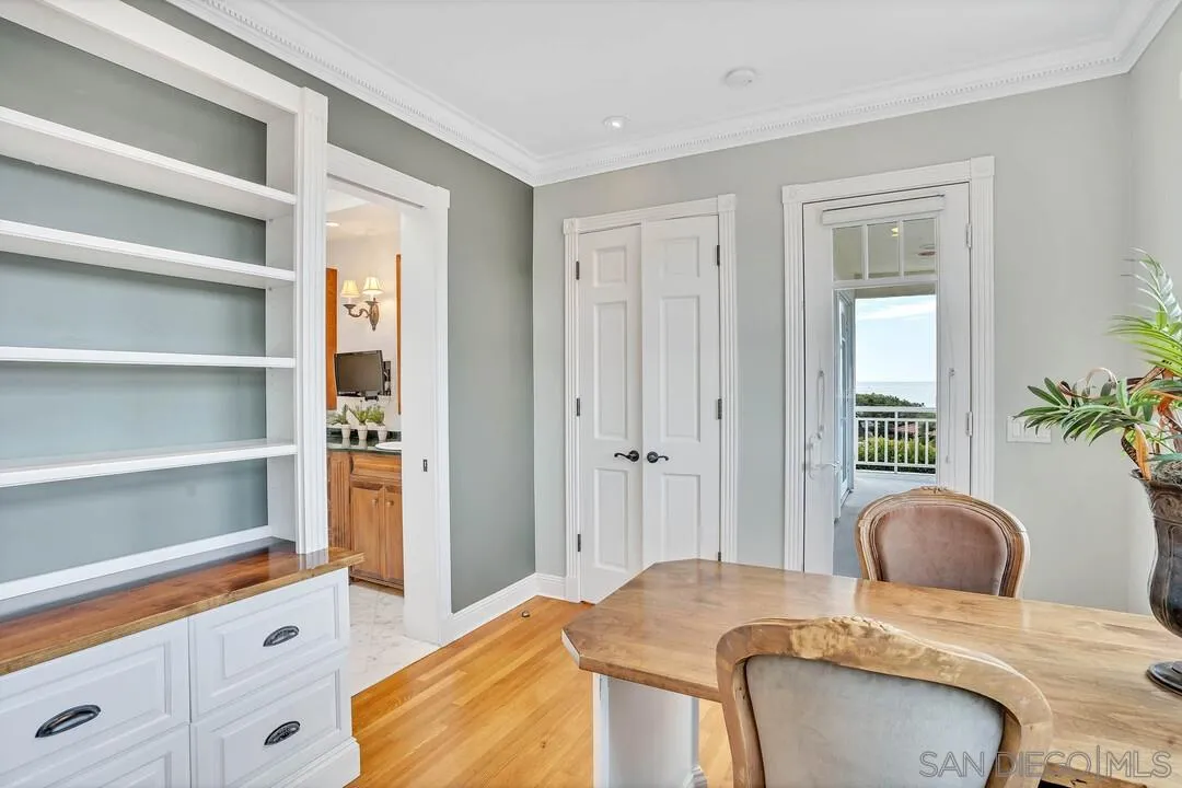 5735 Dolphin Place La Jolla, CA 92037 - Photo 48 of 75 a bedroom with a bed and a window