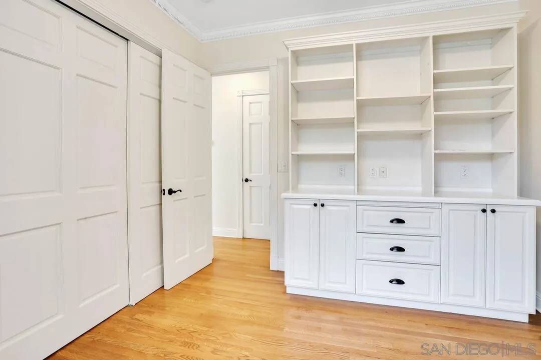 5735 Dolphin Place La Jolla, CA 92037 - Photo 50 of 75 a view of an empty room with cabinet and mirror