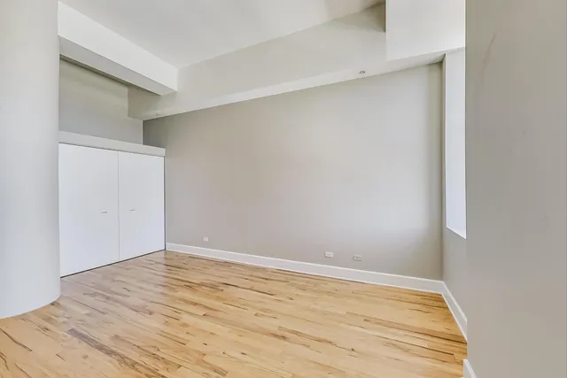 a spacious bathroom with a granite countertop sink a toilet and shower