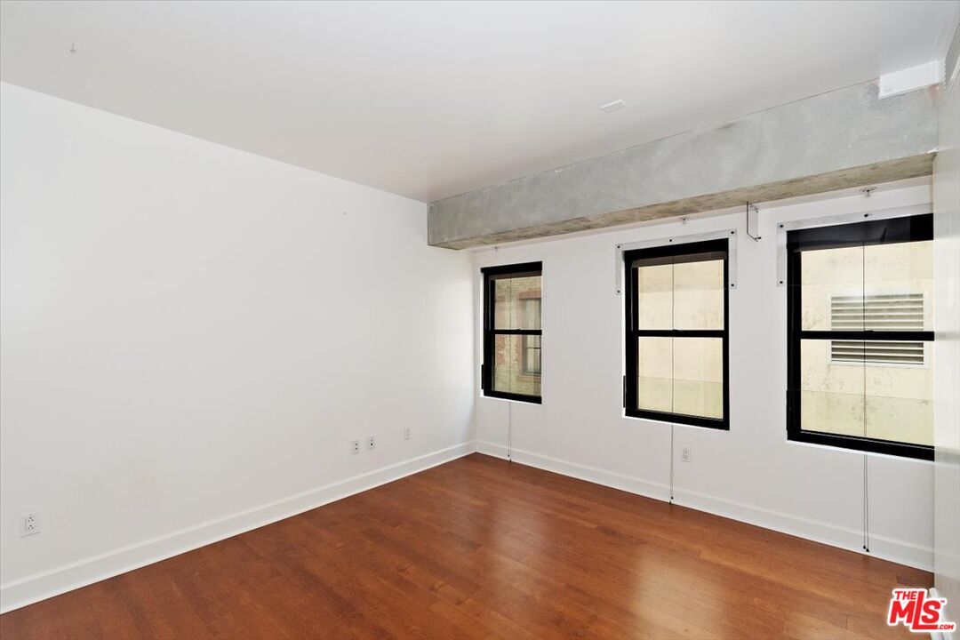 416 South Spring Street, Unit 609 Los Angeles, CA 90013 - Photo 15 of 24 an empty room with windows