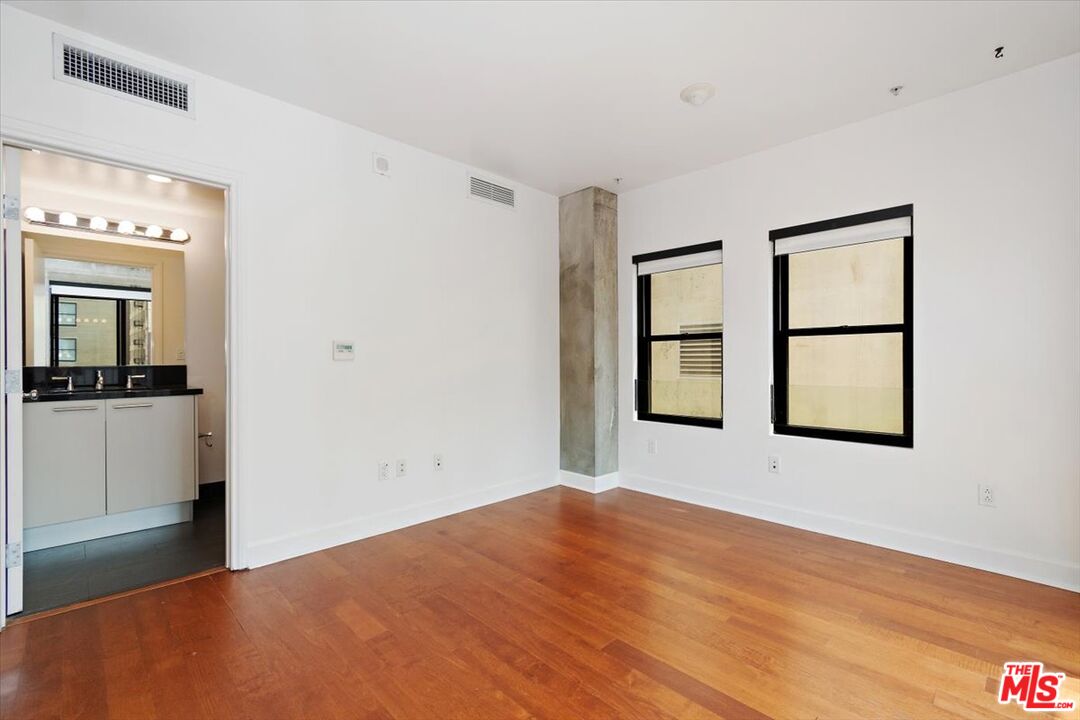416 South Spring Street, Unit 609 Los Angeles, CA 90013 - Photo 17 of 24 a view of an empty room with a window