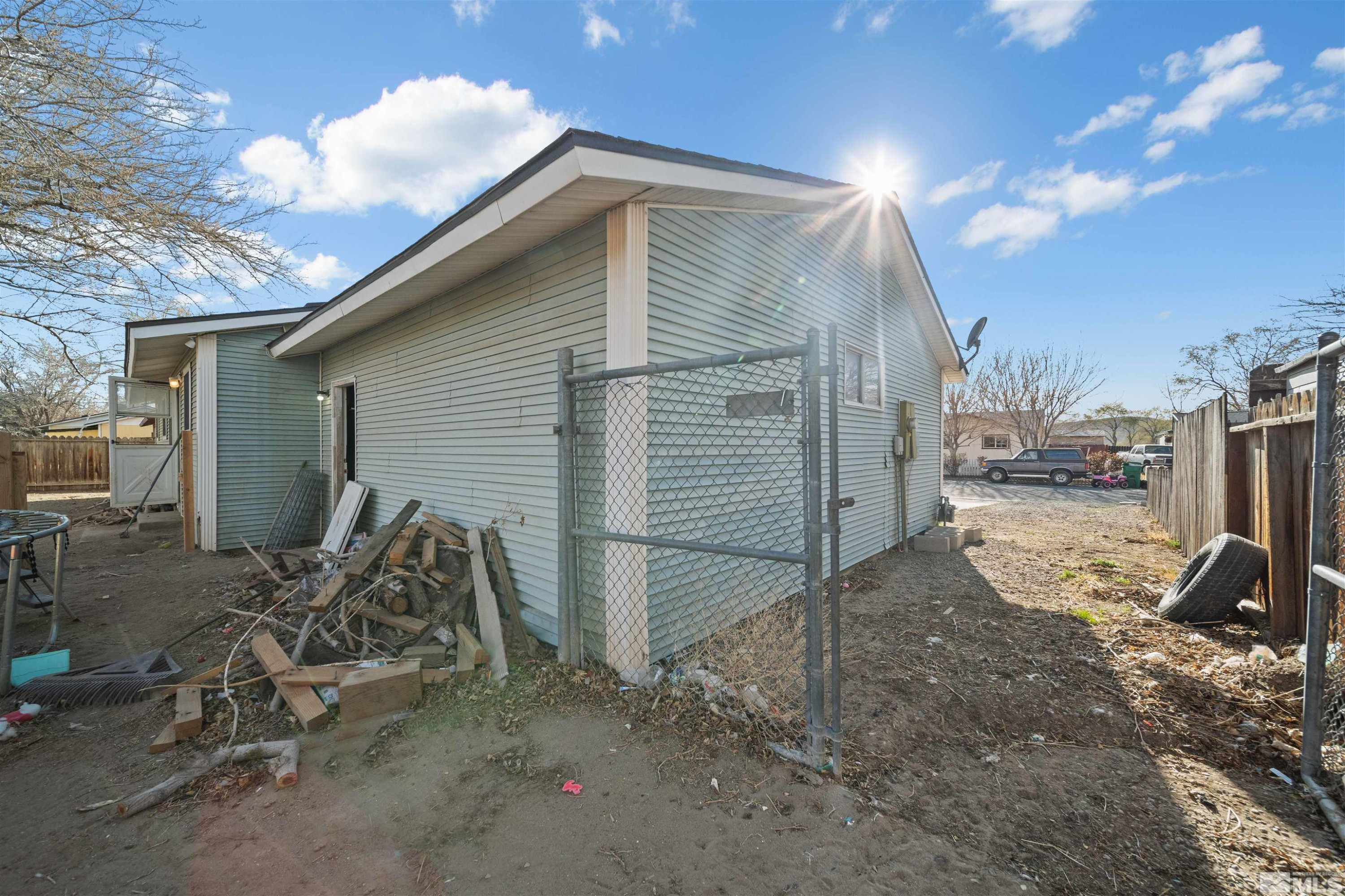 565 Spruce Drive Fernley, NV 89408 - Photo 18 of 19 a view of a house with backyard