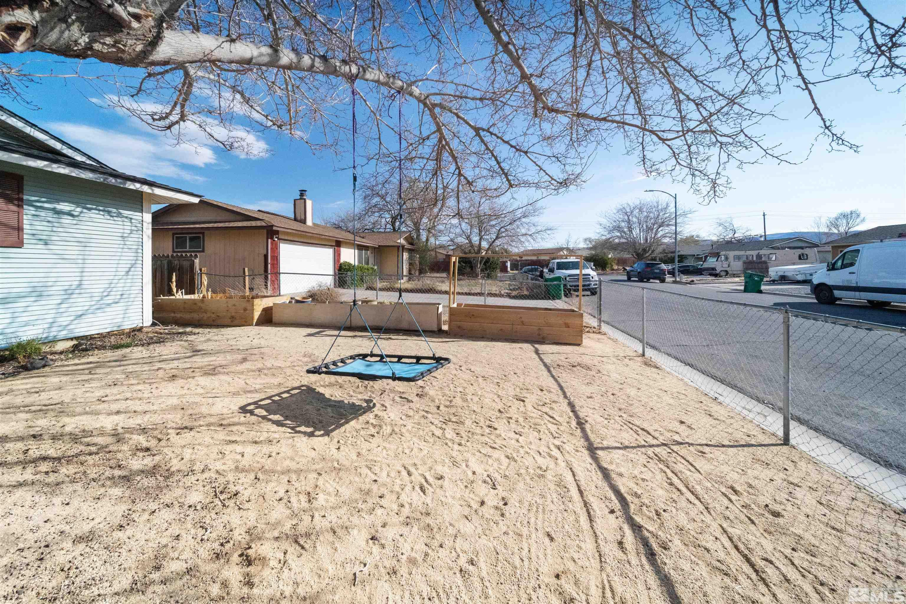 565 Spruce Drive Fernley, NV 89408 - Photo 4 of 19 a view of a backyard of the house