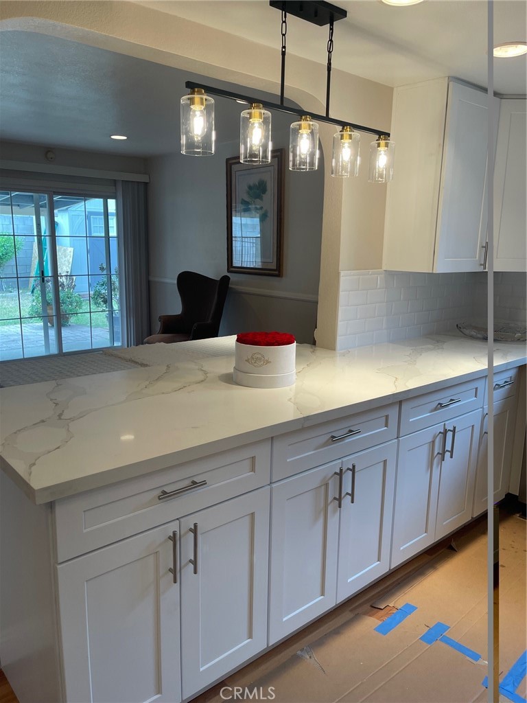 6250 Filkins Avenue Rancho Cucamonga, CA 91737 - Photo 11 of 48 a view of a kitchen counter space with a sink