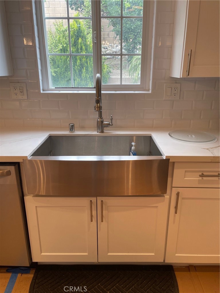 6250 Filkins Avenue Rancho Cucamonga, CA 91737 - Photo 20 of 48 a kitchen with a sink and a cabinet