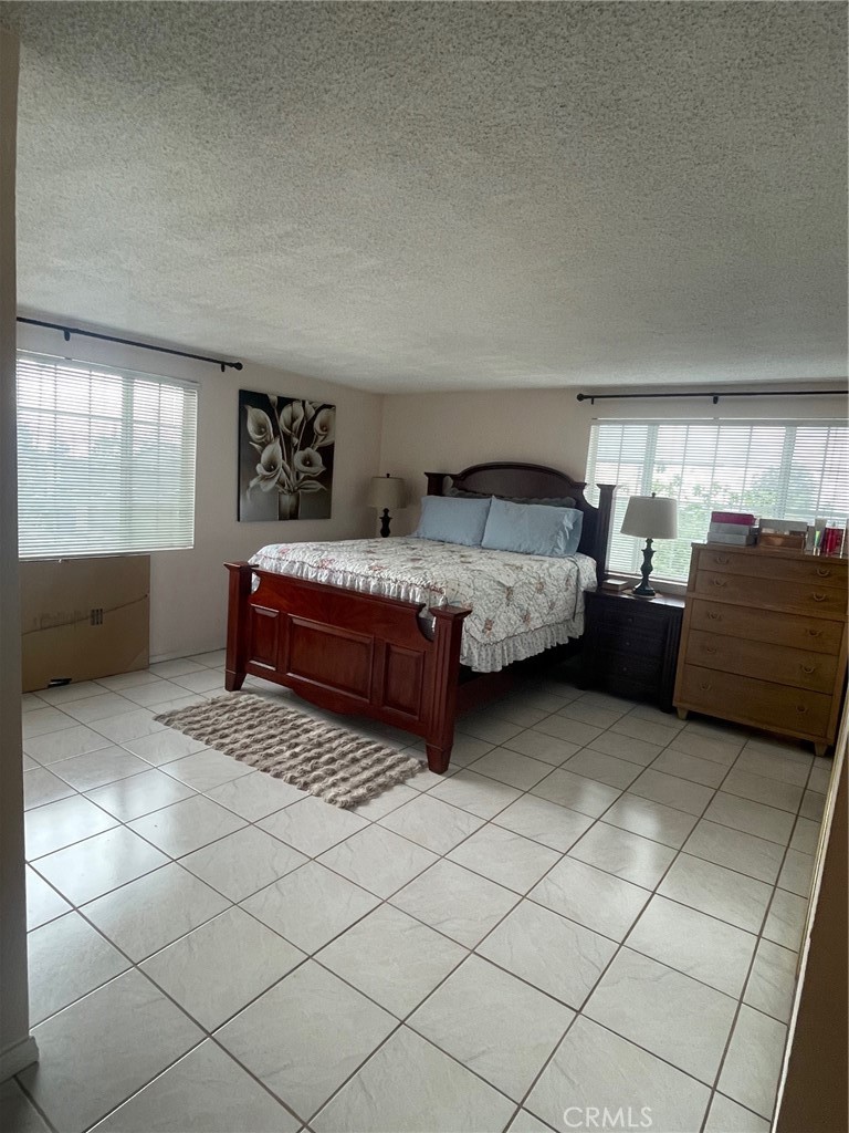 6250 Filkins Avenue Rancho Cucamonga, CA 91737 - Photo 22 of 48 a bedroom with a bed and window