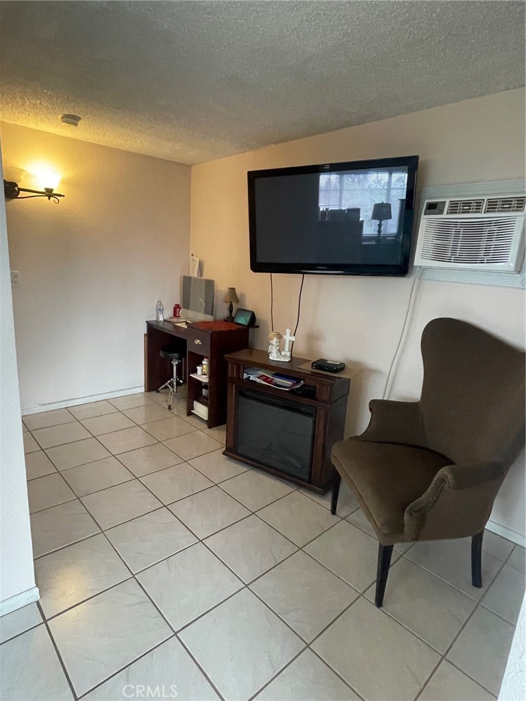 6250 Filkins Avenue Rancho Cucamonga, CA 91737 - Photo 24 of 48 a living room with furniture and a flat screen tv