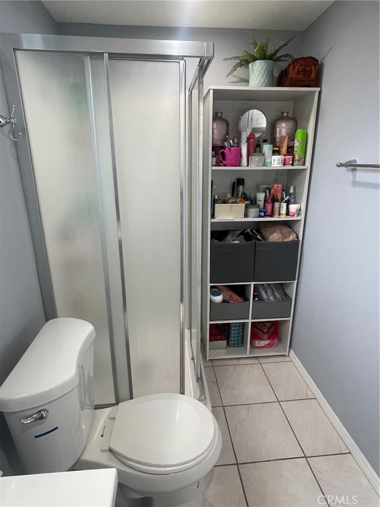 6250 Filkins Avenue Rancho Cucamonga, CA 91737 - Photo 28 of 48 a bathroom with a toilet and a shower