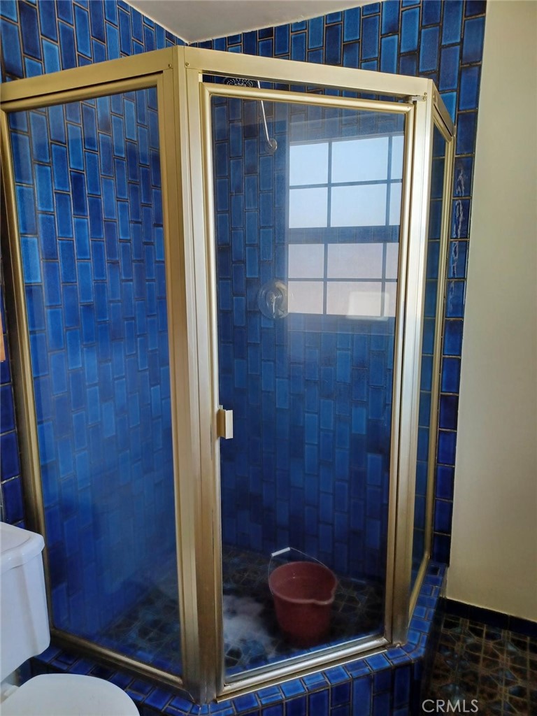 6250 Filkins Avenue Rancho Cucamonga, CA 91737 - Photo 32 of 48 a bathroom with a toilet and a window