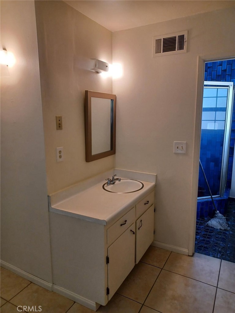 6250 Filkins Avenue Rancho Cucamonga, CA 91737 - Photo 33 of 48 a bathroom with a sink and a mirror
