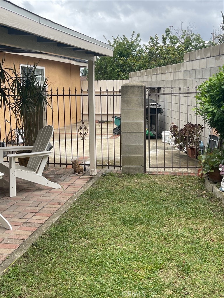 6250 Filkins Avenue Rancho Cucamonga, CA 91737 - Photo 45 of 48 a view of a deck with a floor to ceiling window and a yard